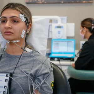 Patient receiving an electromyograph reading at a dental office.
